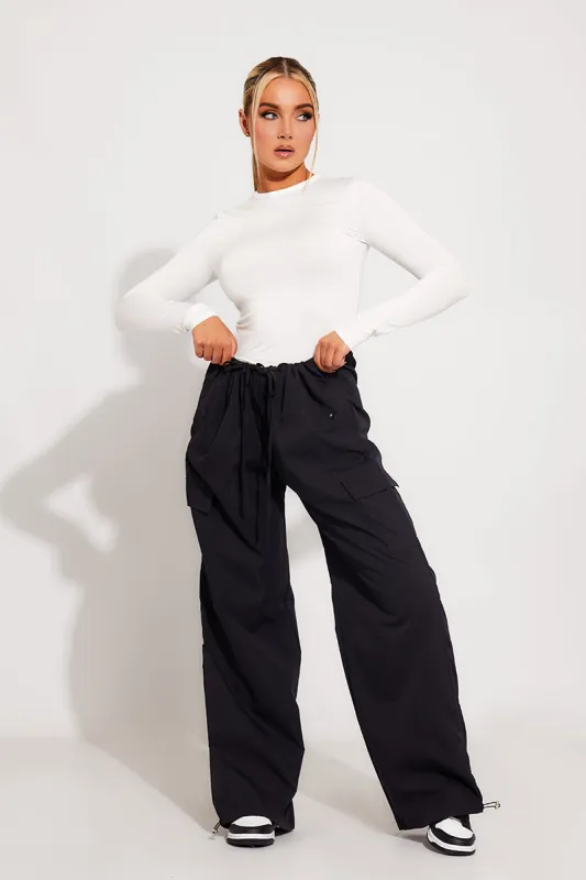 Black Low Rise Oversized Parachute Cargo Pants sold by Nothingbutstyle