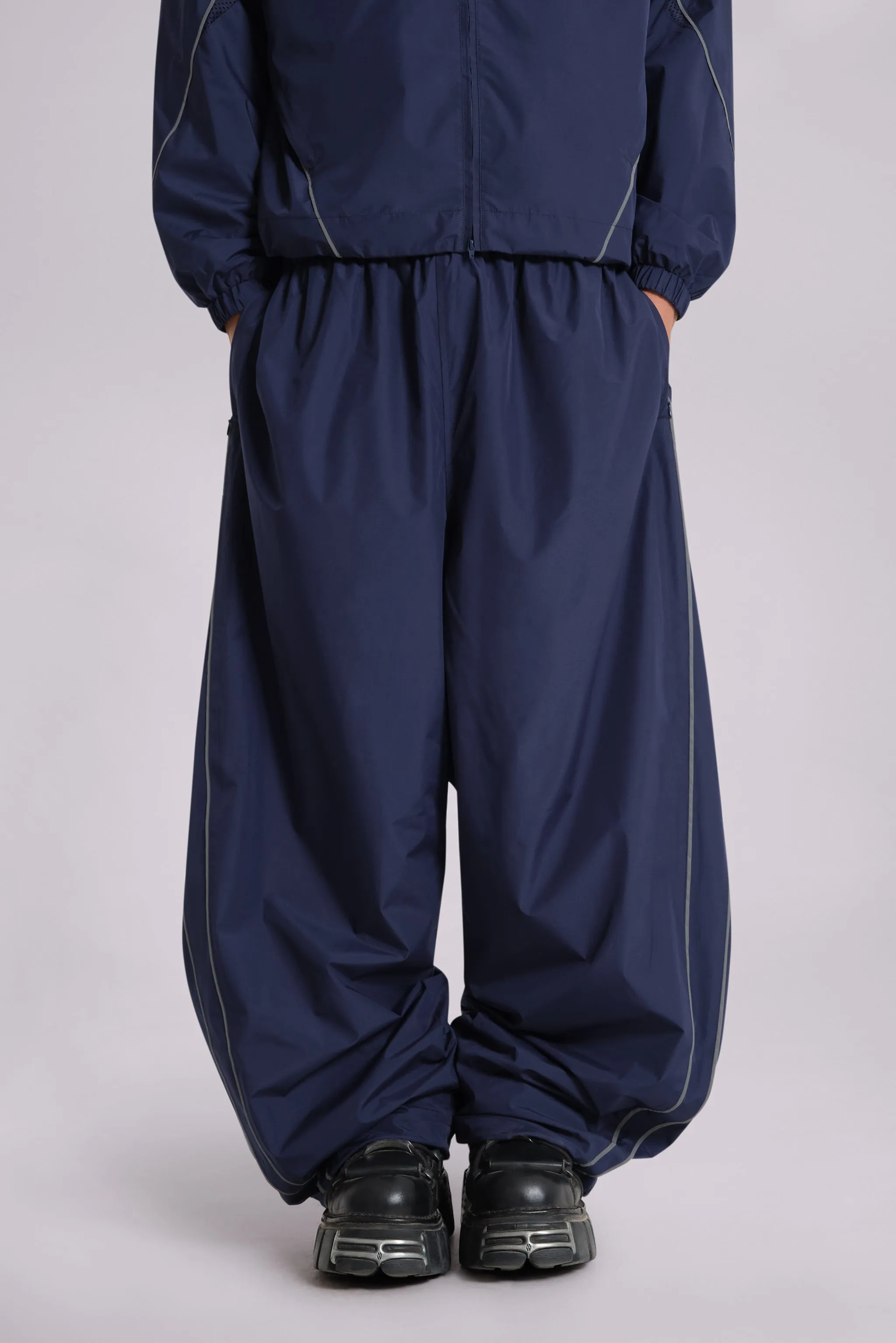 Navy Vapor Tracksuit Bottoms sold by Jaded London