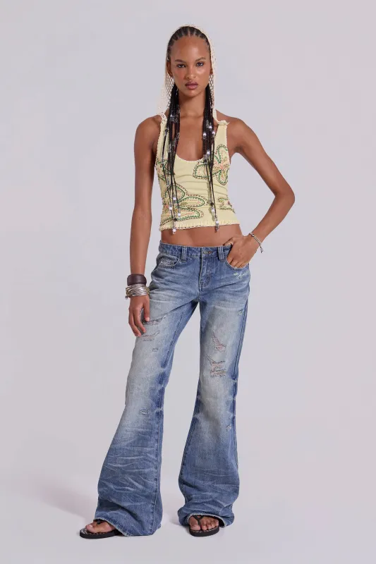 Mid Blue Distressed Creased Drift Flared Jeans sold by Jaded London