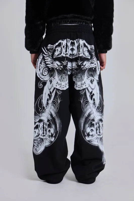 Black Gothic Print Baggy Monster Joggers sold by Jaded London