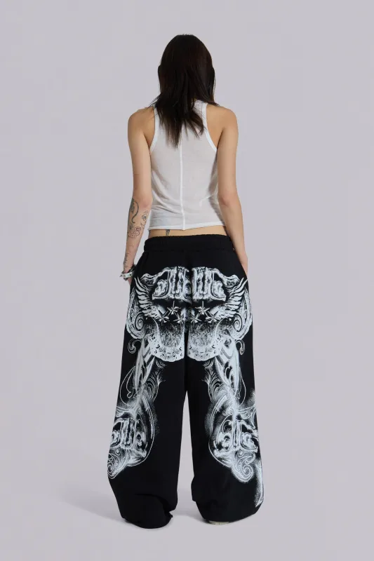 Black Gothic Print Baggy Monster Joggers sold by Jaded London