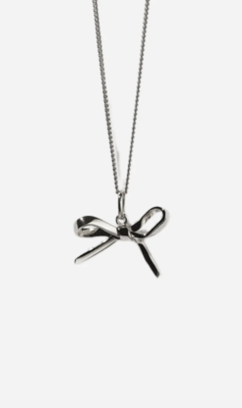 Meadowlark | Bow Charm Necklace - Sterling Silver sold by Sisters & Co
