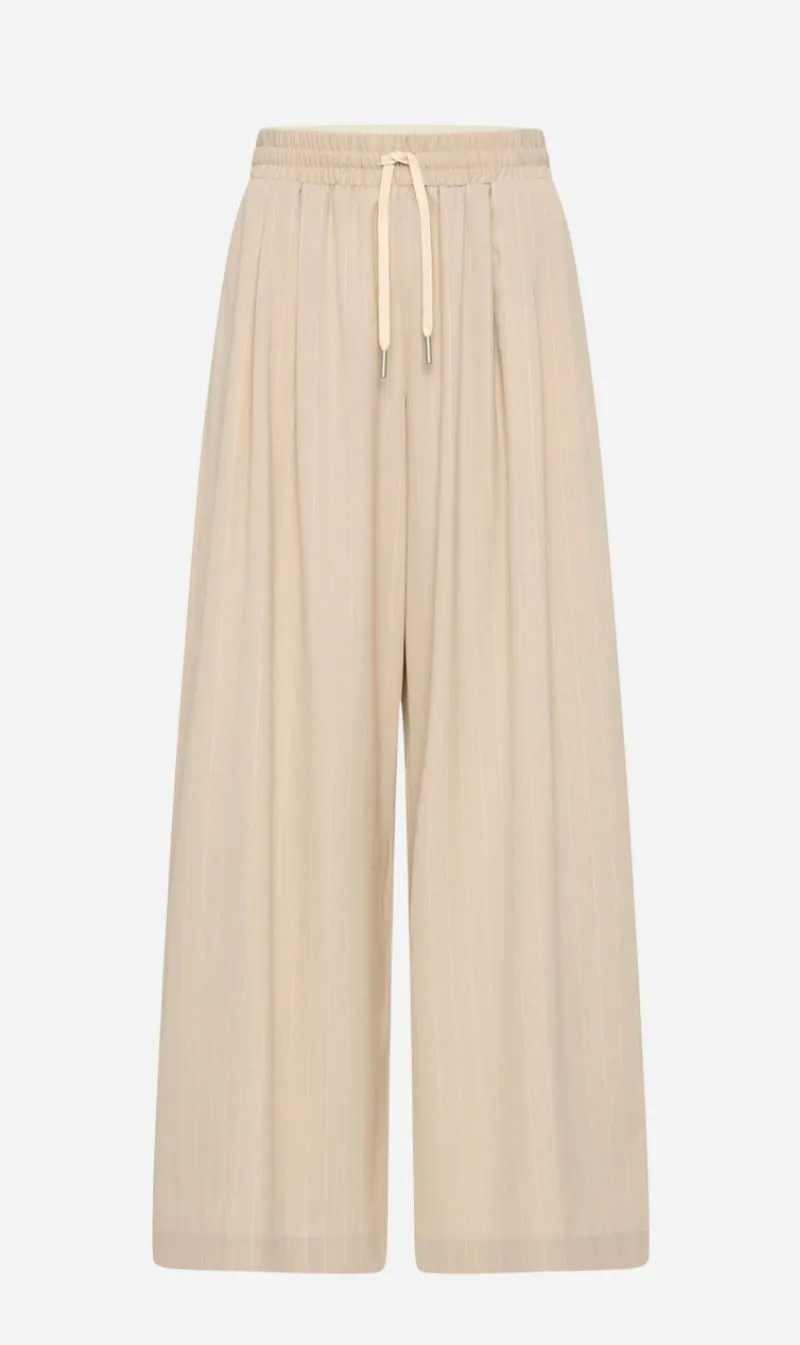 St Agni | Pinstripe Wool Drawstring Pants - Latte sold by Sisters & Co