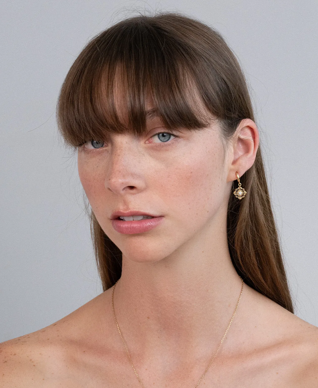 Zoe & Morgan | Centered Earrings - Gold/White Zircon sold by Sisters & Co product image thumbnail 3
