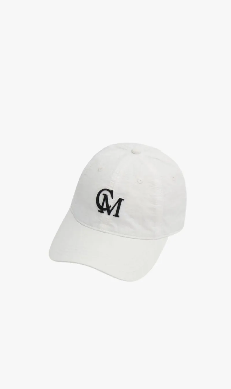 Camilla and Marc | James Cap - White sold by Sister & Co