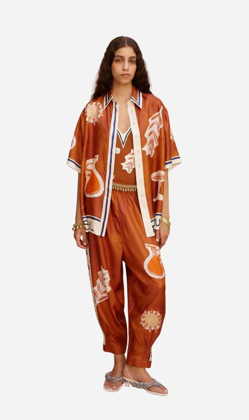 Alemais | Soleil D'Amour Tapered Silk Pant - Rust sold by Sisters & Co