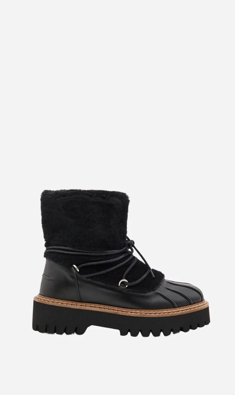 Yves Salomon | Merino Ironed Lamb Shoes - Black sold by Sisters & Co