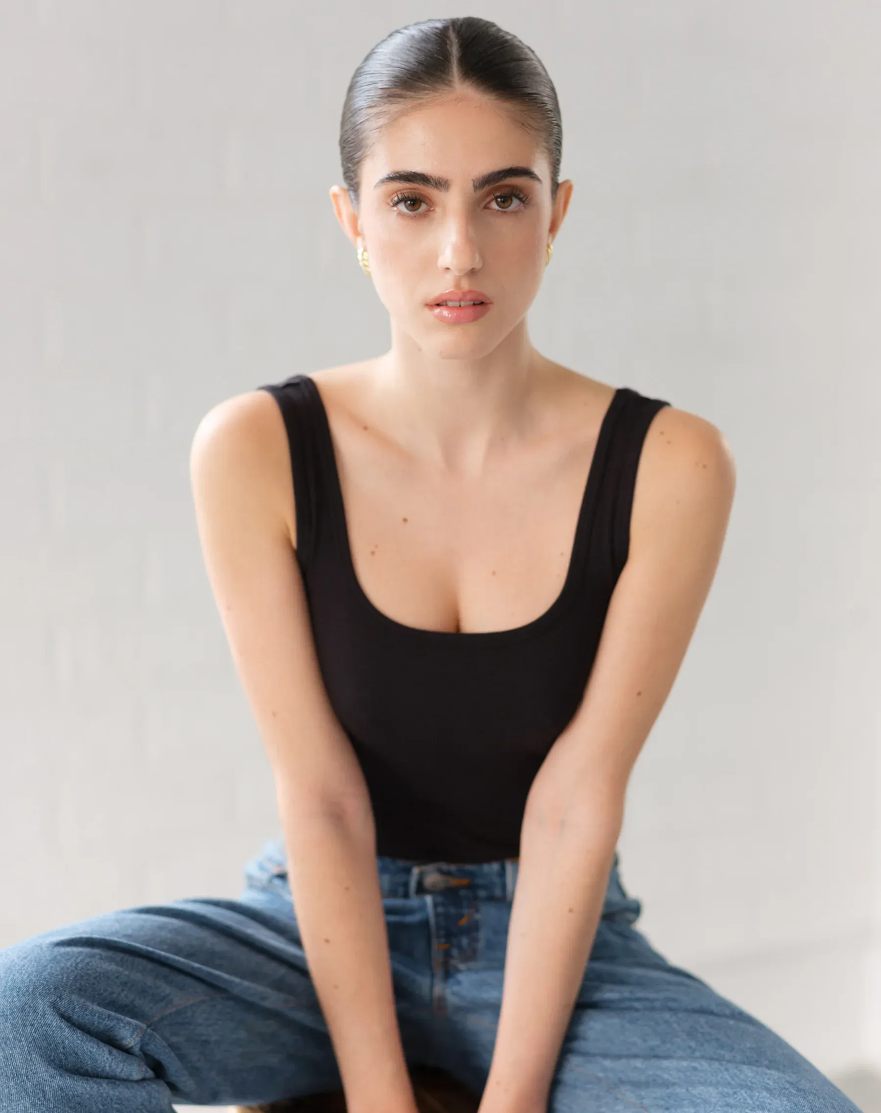 The Ribbed Bodysuit | Black sold by Bella Chic