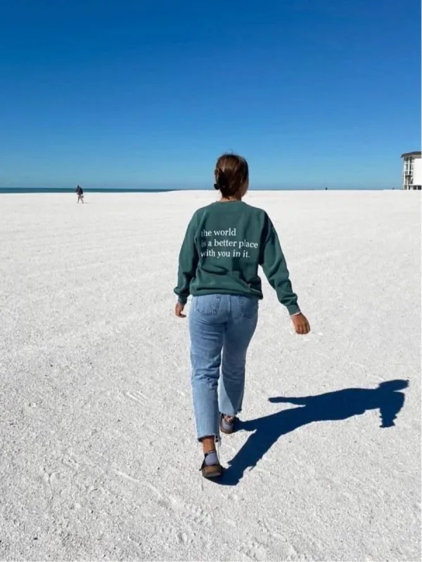 The World Is a Better Place Graphic Sweatshirt | Vintage Green sold by Bella Chic