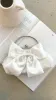 Satin Bow Clutch - White sold by Billy J