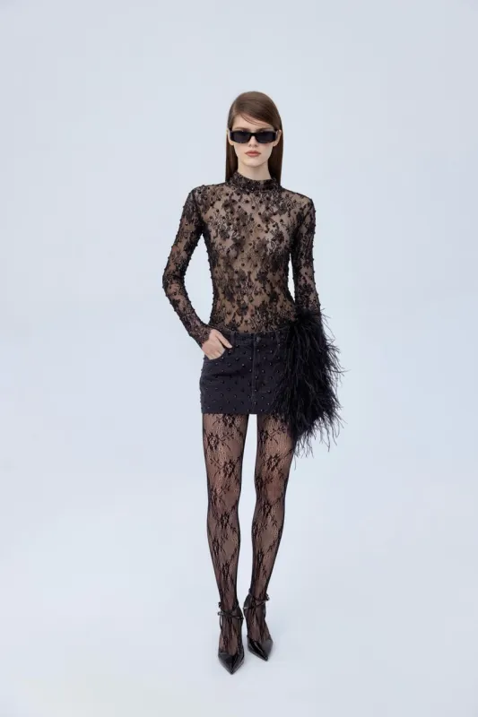 Diamante mini jeans skirt with feathers sold by Santa Brand