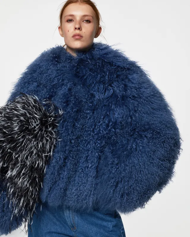 Short fur coat with hood sold by Santa Brand