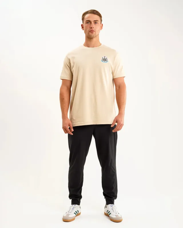 Newcastle United Men's Oat Terrace Crest T-Shirt sold by Newcastle United