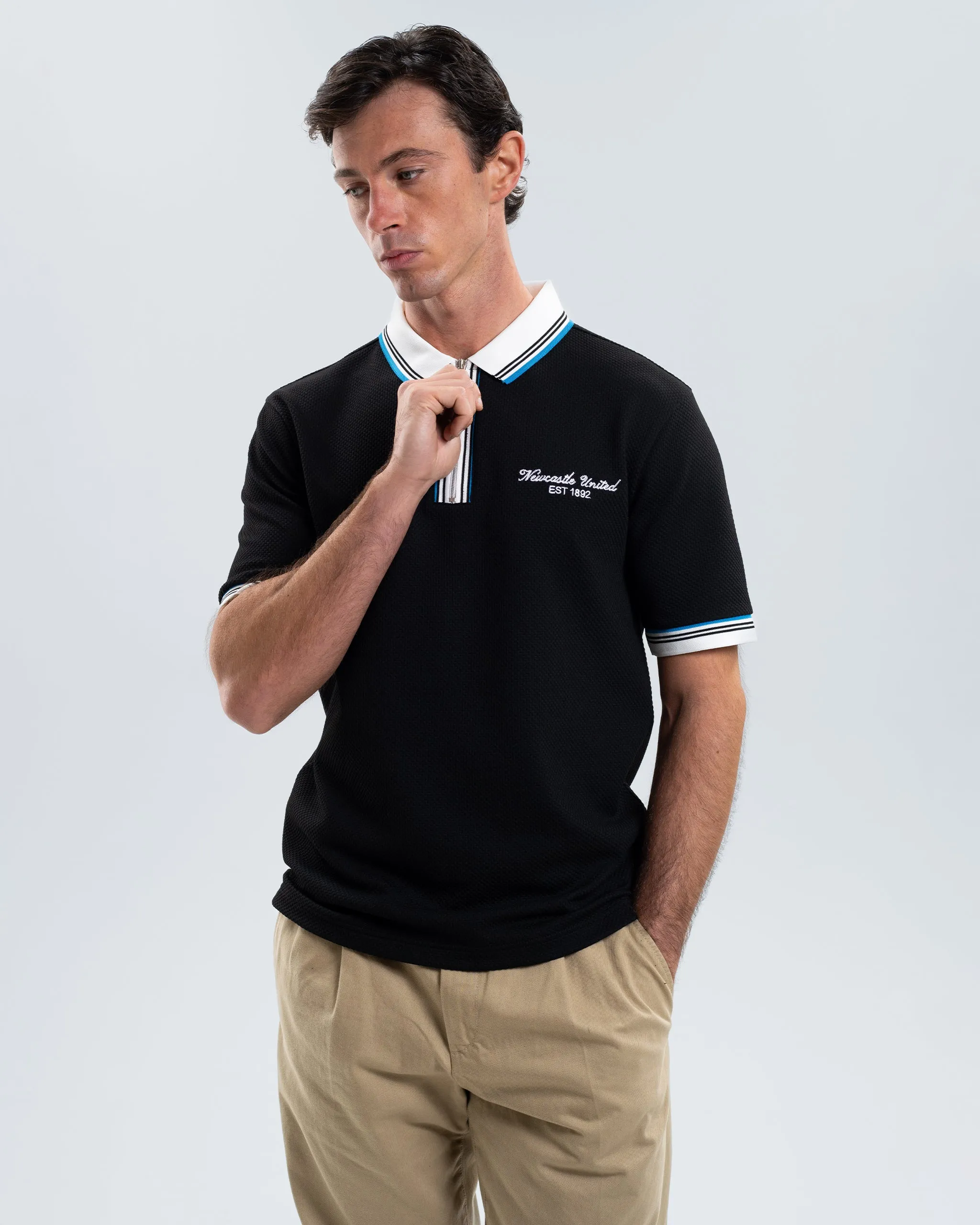 Newcastle United Men's Zipped Black Polo Shirt sold by Newcastle United product image thumbnail 4