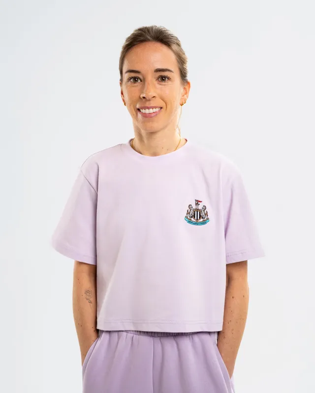 Newcastle United Women's St. James' Studio Lilac Cropped T-Shirt sold by Newcastle United
