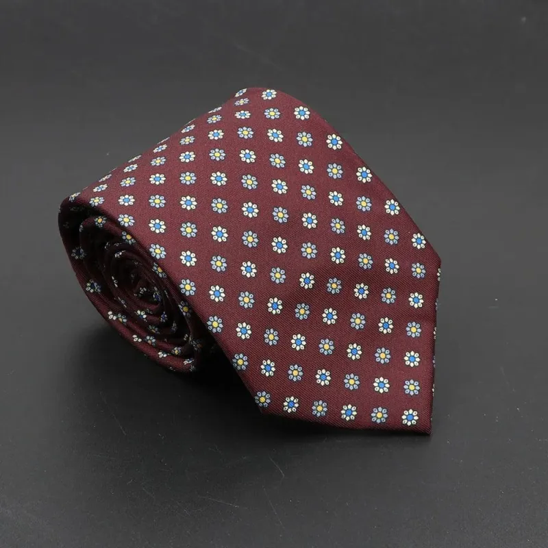 Sciacca · corbata granate con estampado floral azul y amarillo made by Barlovento de Biar