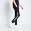 Joggers De Corte y Confección Con Panel De Texto Niño - Negro sold by Eleven degrees