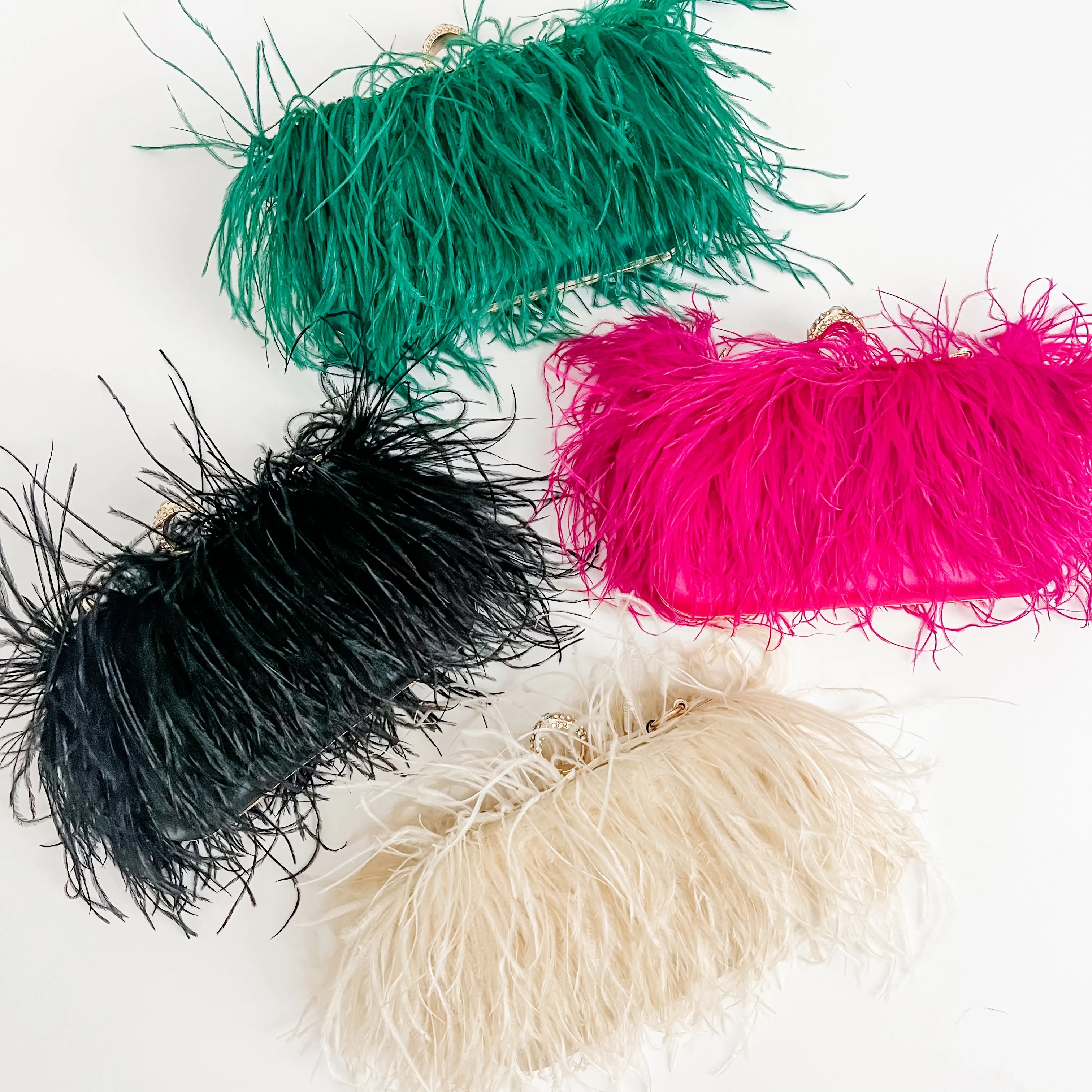 Feathers Evening Clutch sold by Mimosa