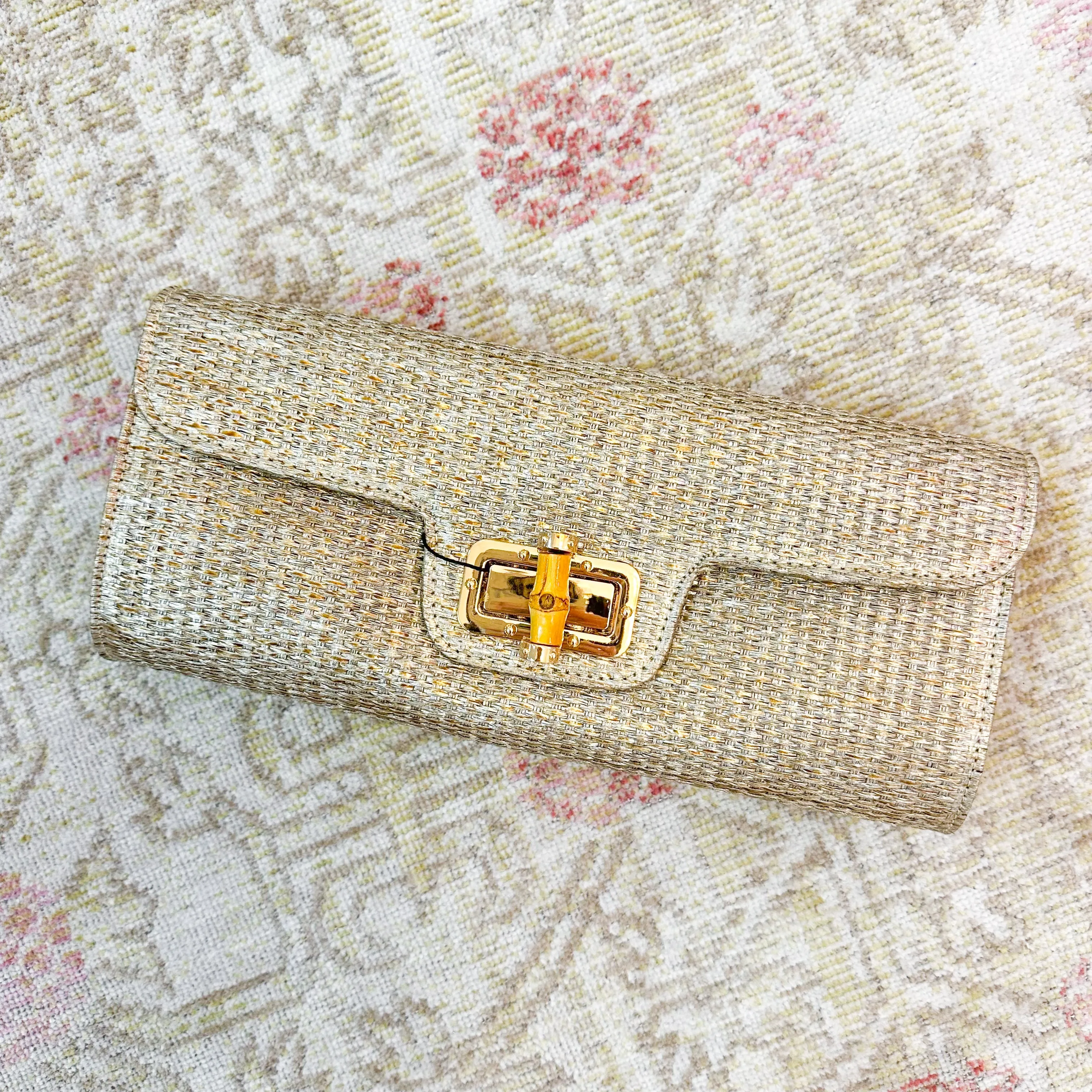 Metallic Bamboo Clutch sold by Mimosa