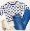 Brighton Bows Sweater Top sold by Mimosa