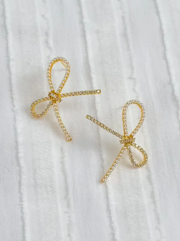 Gemelli Pearl Bow Studs sold by Mimosa