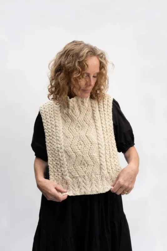 The Aran Handknit Cable Body Bib sold by Stable of Ireland