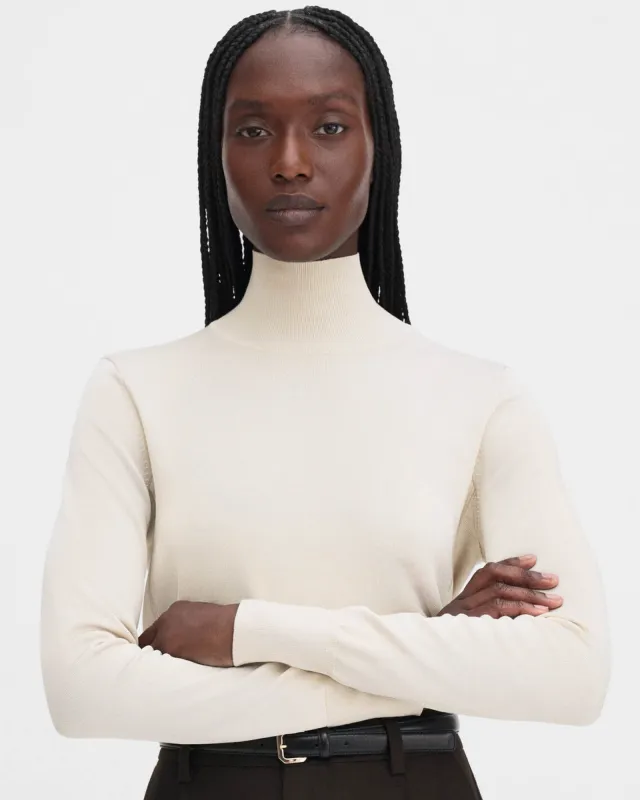 Glossy Turtleneck Sweater sold by TNT Fashion