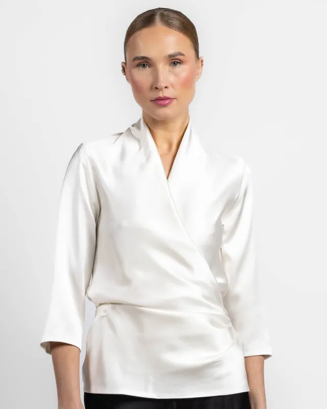 Three-Quarter Sleeve Wrap Top sold by TNT Fashion