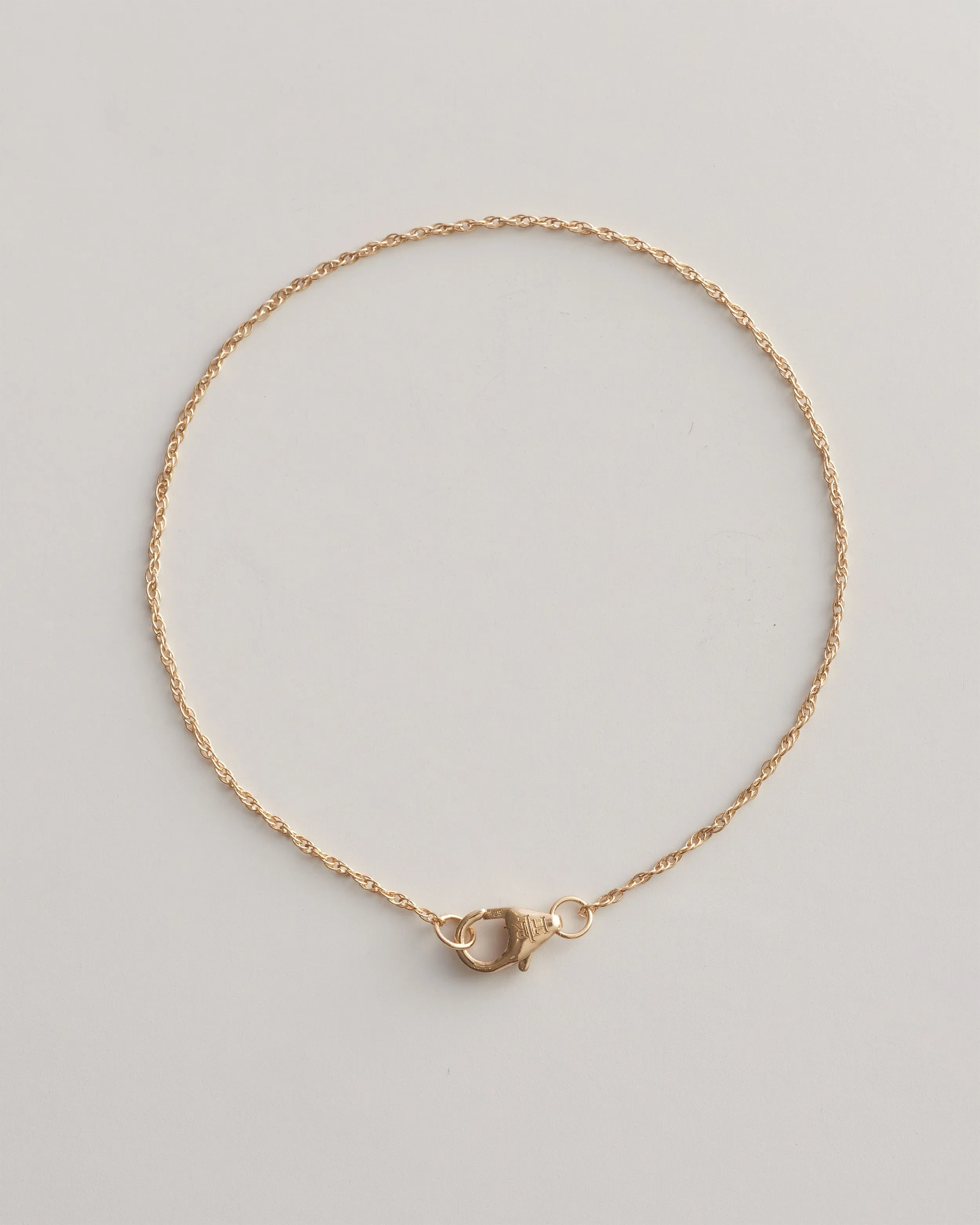 The Golden Thread Bracelet sold by High Light Rituals
