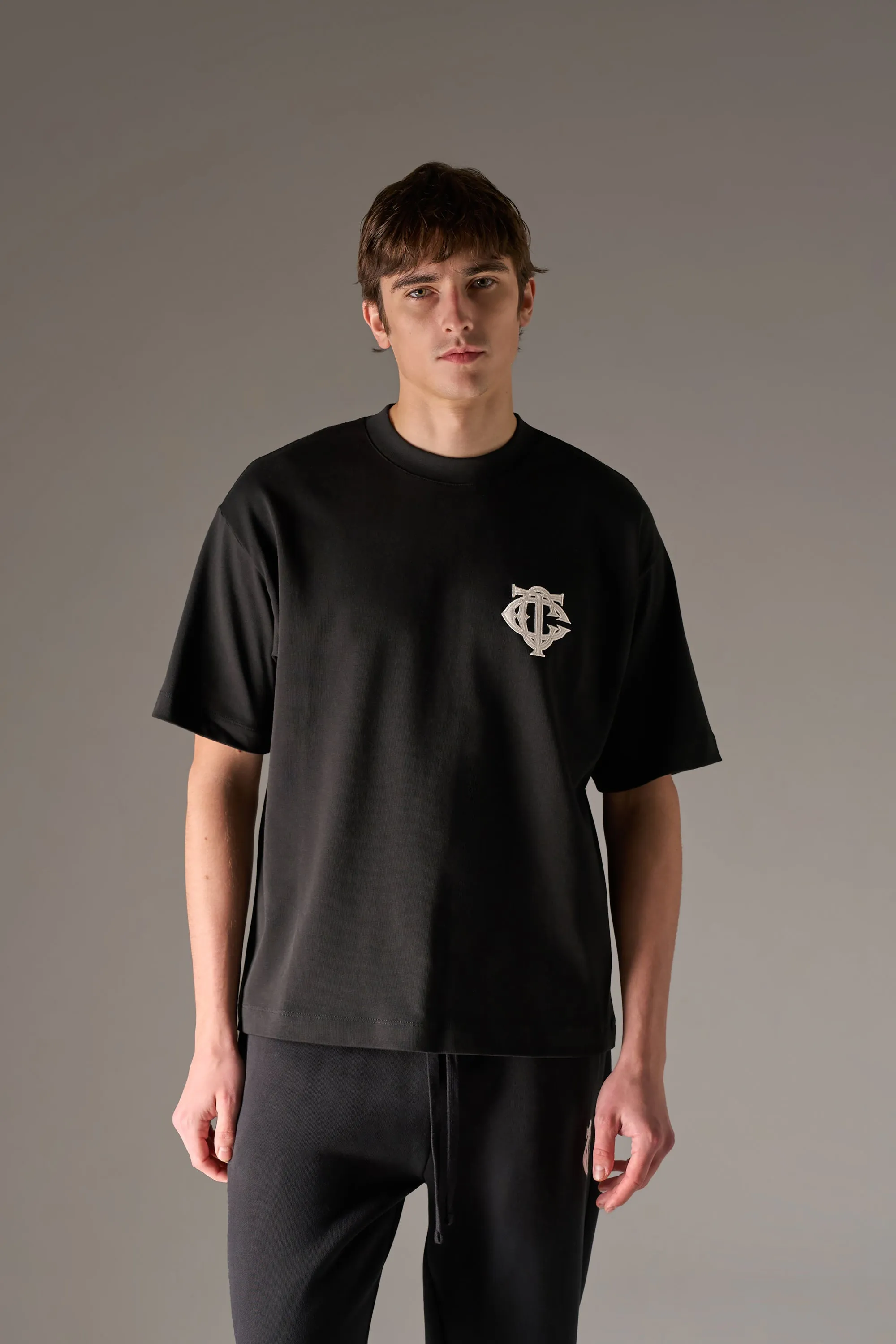 APPLIQUE MONOGRAM EMBLEM T-SHIRT - BLACK sold by The Couture Club