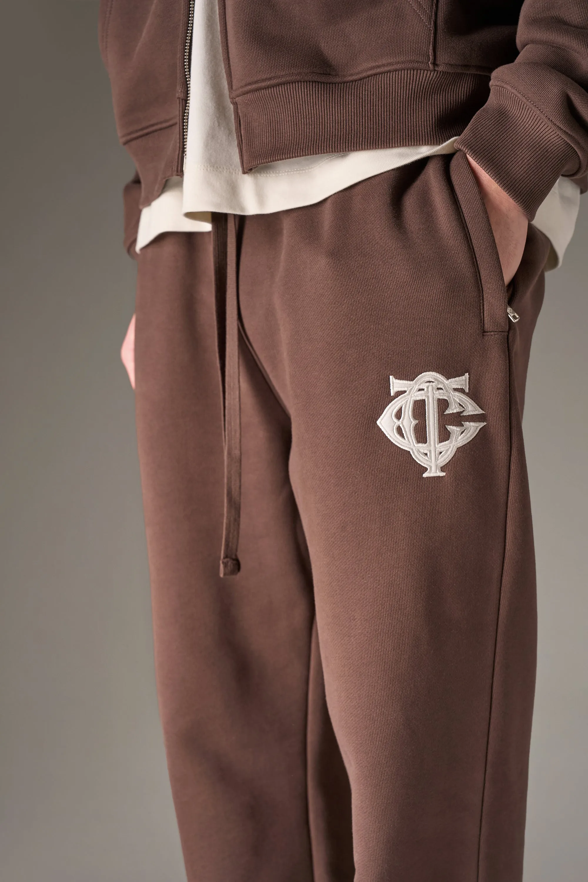 HEAVYWEIGHT MONOGRAM APPLIQUE EMBLEM JOGGERS - BROWN sold by The Couture Club product image thumbnail 5