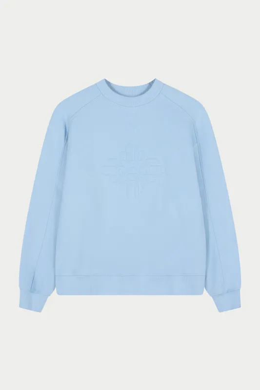 RAISED EMBLEM CREW - POWDER BLUE sold by The Couture Club