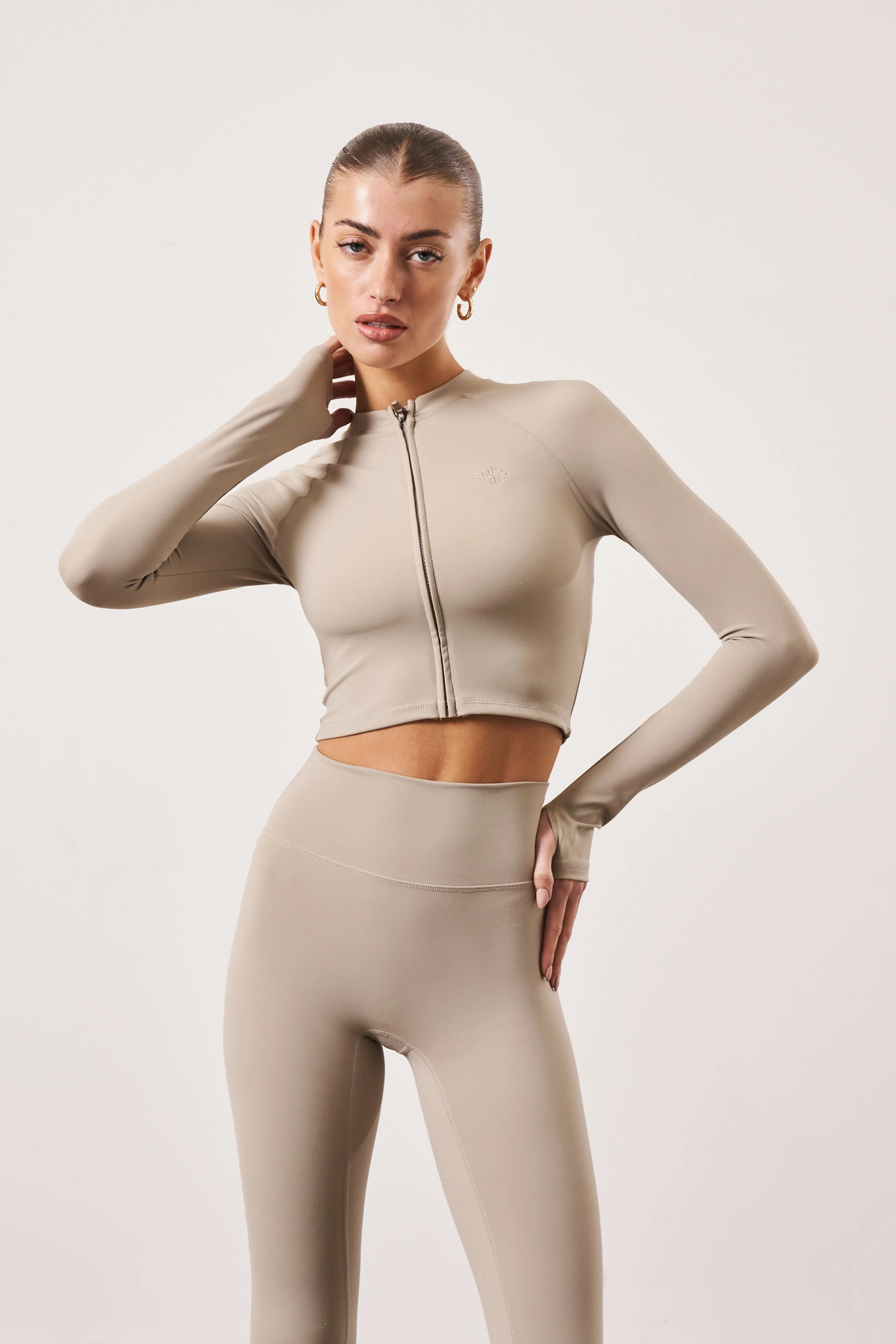 SCULPTING EMBLEM ZIP THROUGH TOP - BEIGE sold by The Couture Club product image thumbnail 2