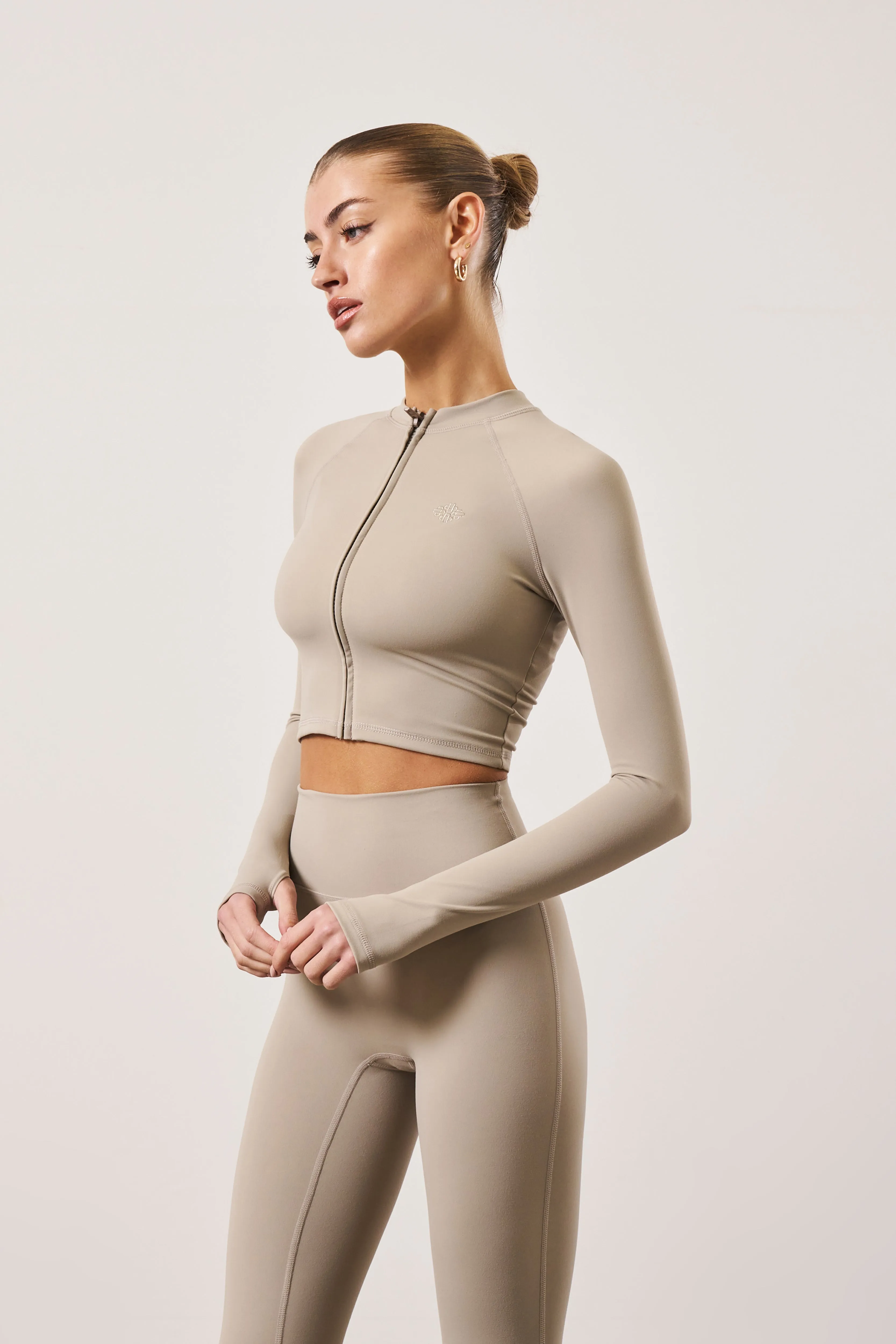 SCULPTING EMBLEM ZIP THROUGH TOP - BEIGE sold by The Couture Club product image thumbnail 4