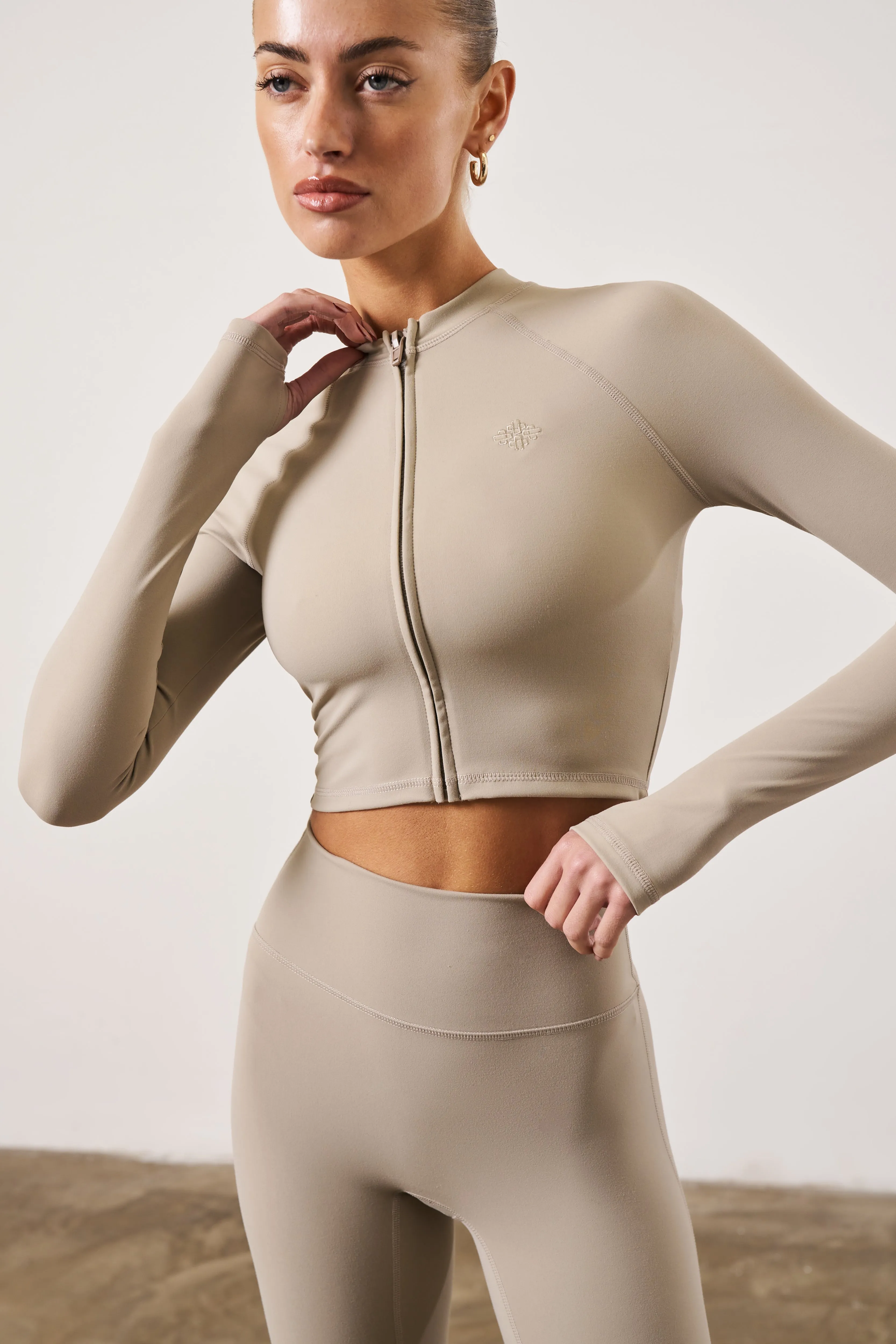 SCULPTING EMBLEM ZIP THROUGH TOP - BEIGE sold by The Couture Club product image thumbnail 5