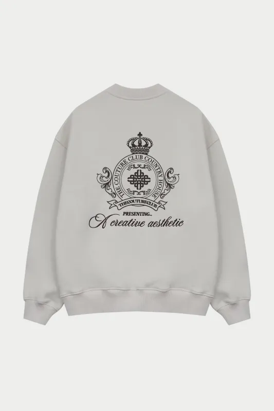 EMBROIDERED CREST OVERSIZED SWEATSHIRT - BONE sold by The Couture Club