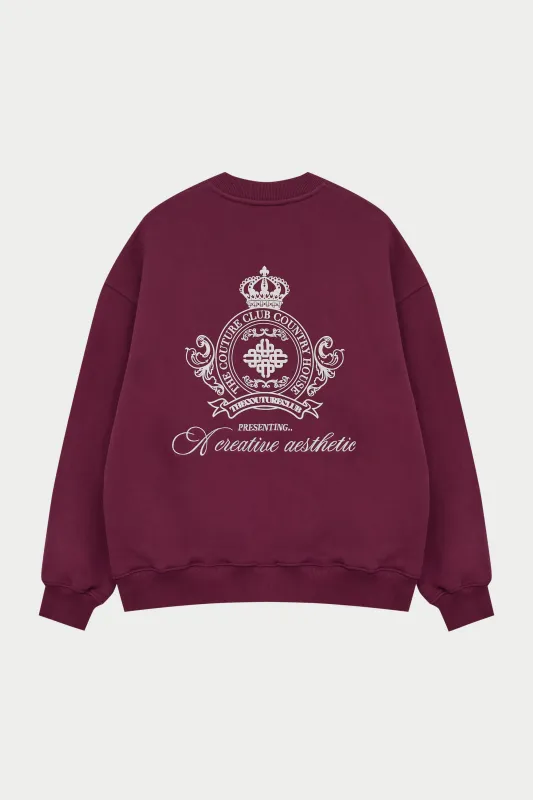 EMBROIDERED CREST OVERSIZED SWEATSHIRT - BURGUNDY sold by The Couture Club