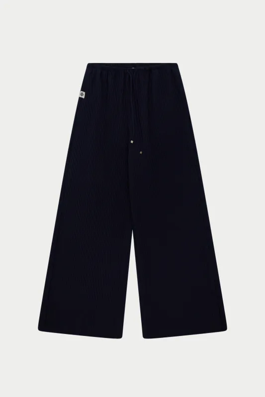 PLISSE TROUSERS - NAVY sold by The Couture Club