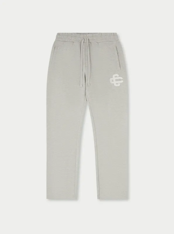 HEAVYWEIGHT APPLIQUE EMBLEM JOGGERS - GREY MARL sold by The Couture Club