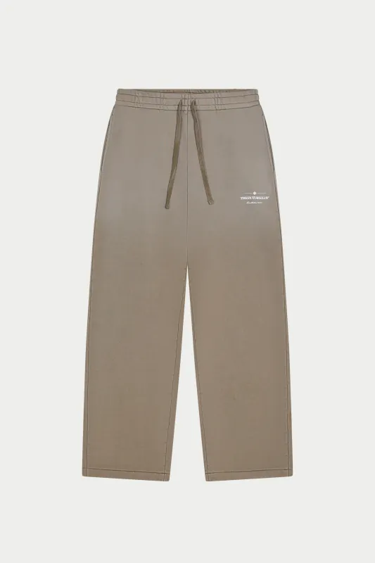 SPRAY WASH COPYRIGHT MULTI GRAPHIC JOGGERS - BEIGE made by The Couture Club