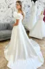 White Off-the-Shoulder Ruffle Long Bridal Gown sold by KissProm