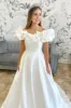 White Off-the-Shoulder Ruffle Long Bridal Gown sold by KissProm