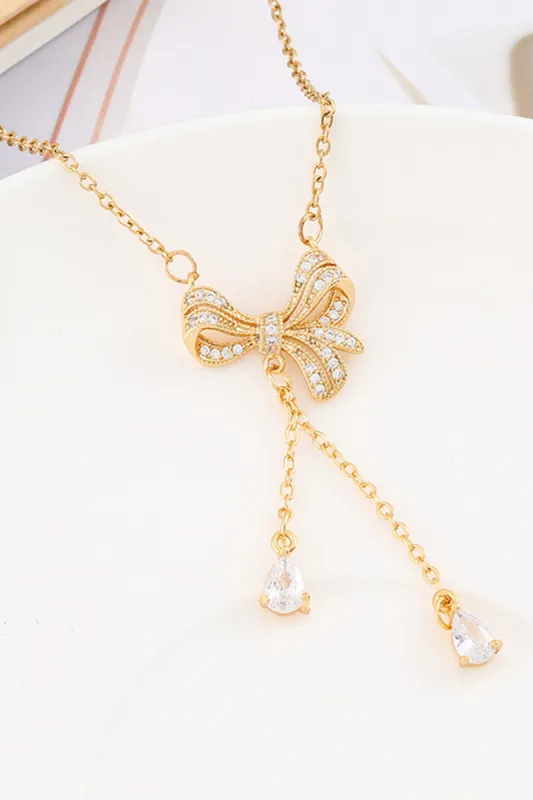 Golden Bow Necklace sold by KissProm