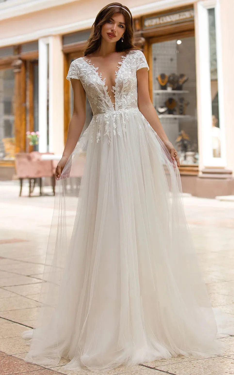 Sexy A Line Plunging Neckline Tulle Sweep Train Wedding Dress with Appliques sold by KissProm