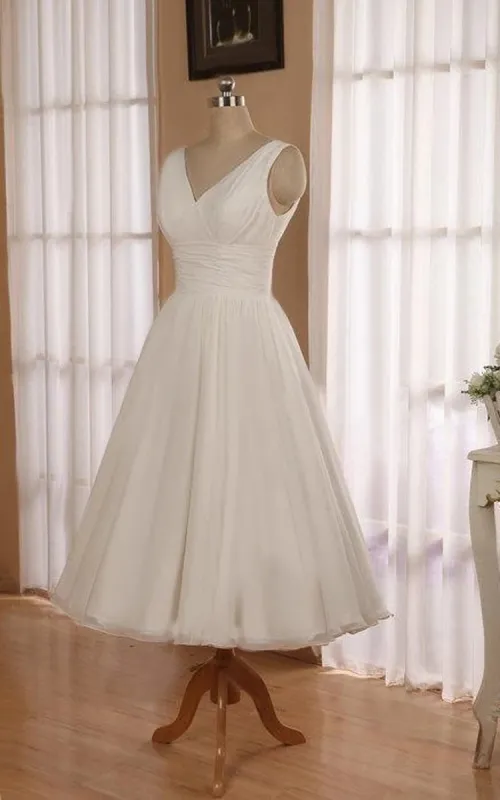 V-Neck Sleeveless Tea-Length Chiffon Wedding Dress With Ruching And Low-V Back sold by KissProm