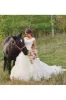 V-neck Ruffles Tiered Skirt A-line Lace Organza Wedding Dress with Cap Sleeves sold by KissProm