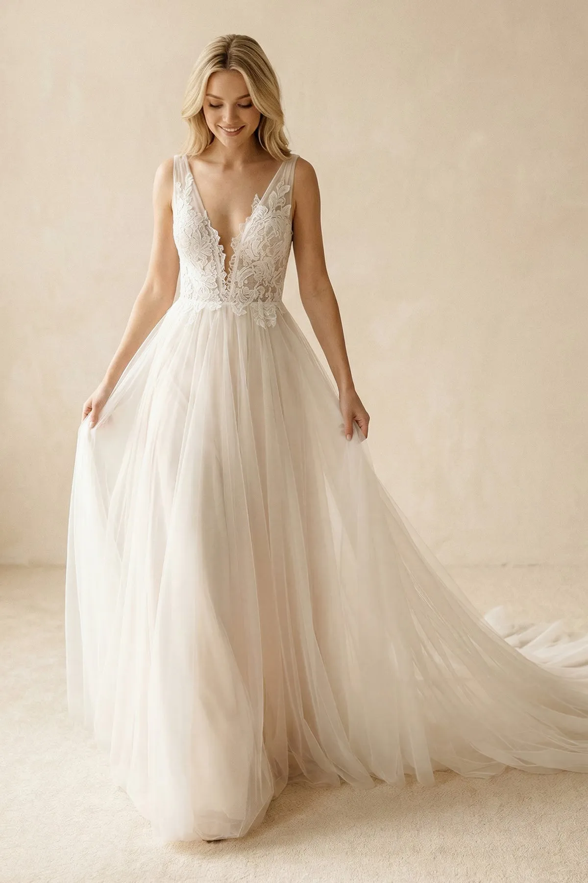 Deep V-Neck Tulle A-Line Appliqued Wedding Dress in Ivory sold by KissProm