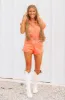 Just So You Know Denim Romper - Washed Orange sold by Hazel & Olive
