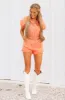 Just So You Know Denim Romper - Washed Orange sold by Hazel & Olive