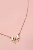 Mini Bow Necklace - Gold sold by Hazel & Olive